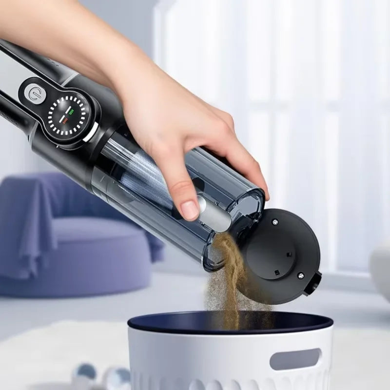 Hand using a handheld coffee grinder to pour ground coffee into a white container