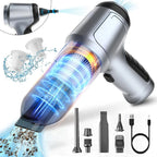Portable vacuum cleaner with attachments and USB cable on a white background