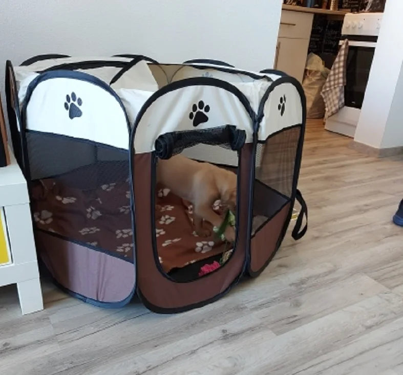Pet playpen with a dog inside on a wooden floor