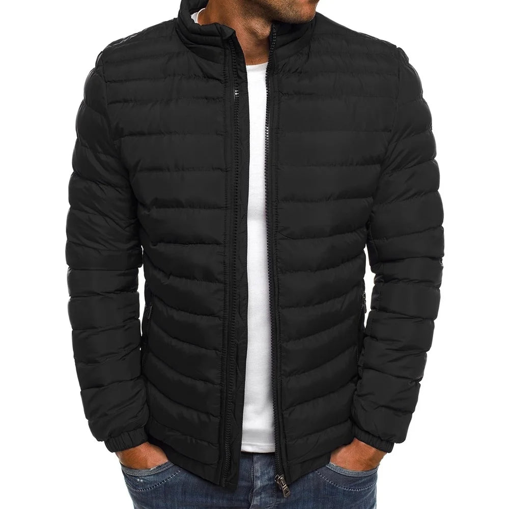 Black puffer jacket worn by a person on a white background