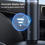 Black car air freshener with blue display light on a car dashboard