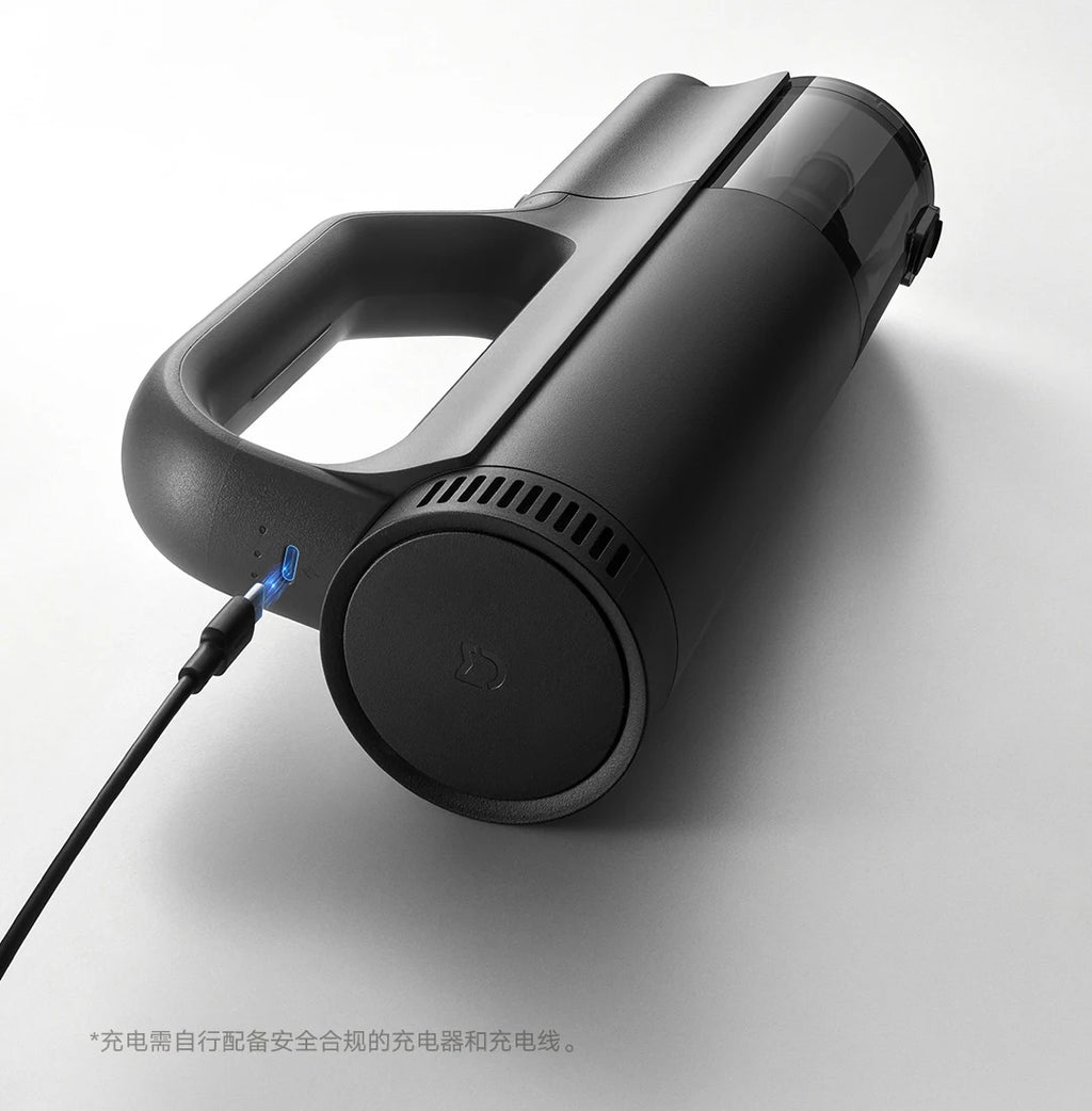 Black handheld vacuum cleaner on a white background