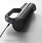 Black handheld vacuum cleaner on a white background