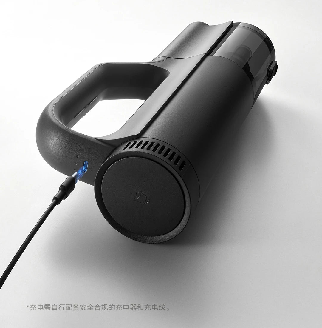 Black handheld vacuum cleaner on a white background