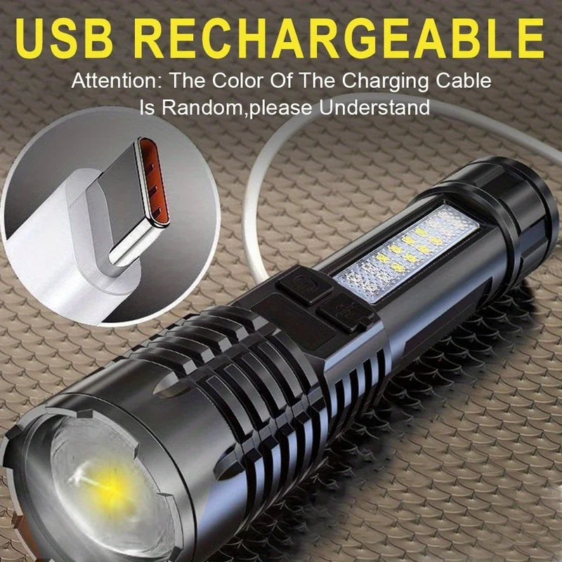 USB rechargeable flashlight with charging cable on a textured surface
