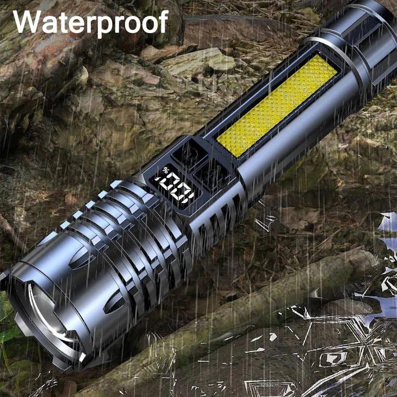 Waterproof flashlight on a wet surface with water droplets