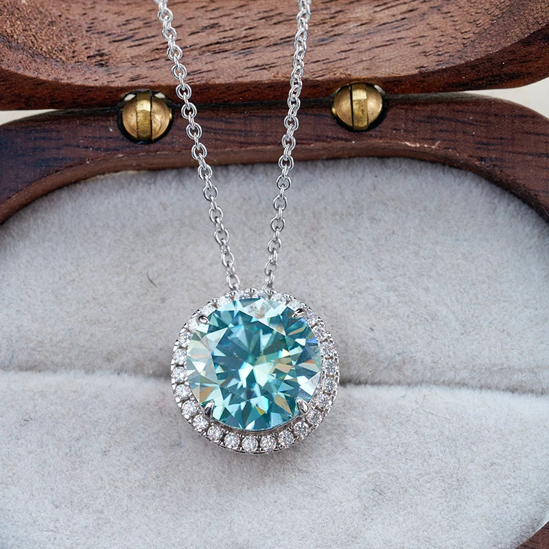 Necklace with a blue gemstone pendant on a wooden stand