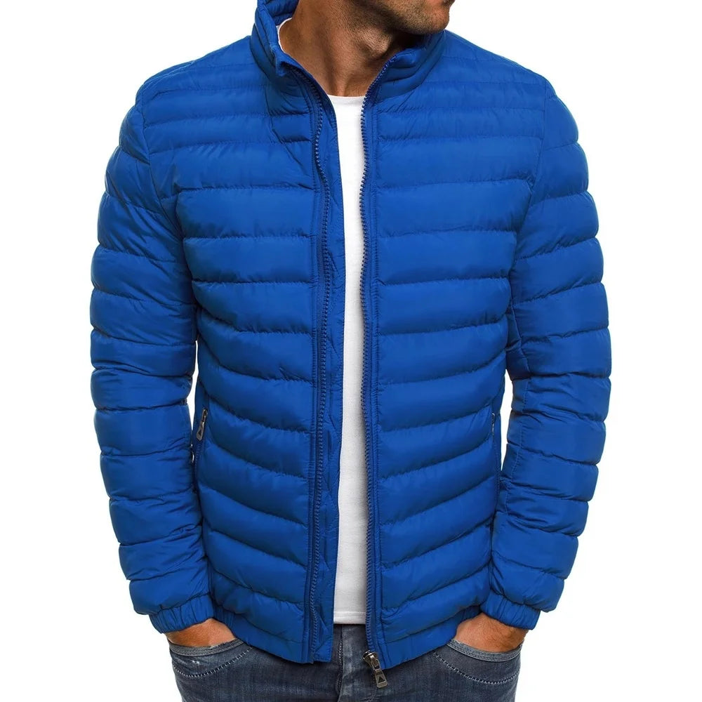 Blue puffer jacket worn by a person on a white background