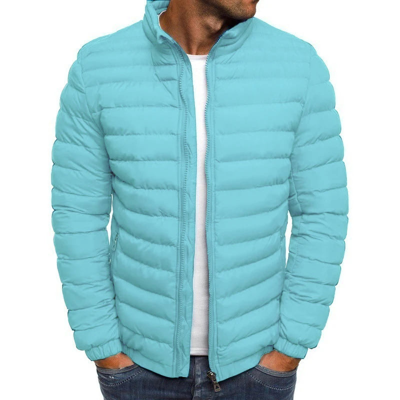 Light blue puffer jacket worn by a person on a white background