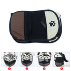 Pet carrier with paw print design on a white background