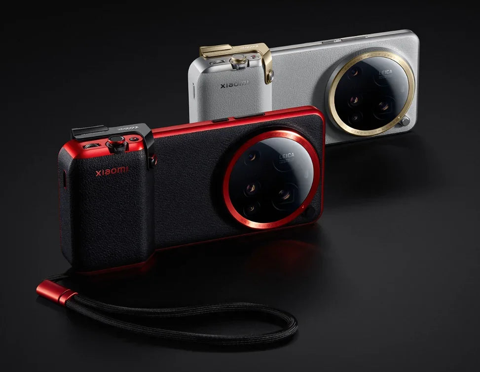 Two Xiaomi camera devices, one red and black, the other silver and gold, on a dark background.