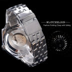 Silver watchband with folding clasp on a black background
