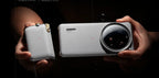 Two smartphones held side by side with a dark background
