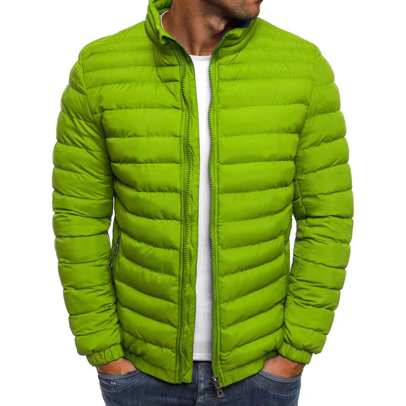 Green puffer jacket worn by a person on a white background