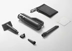 Black handheld vacuum cleaner with attachments on a white background