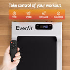 Everfit treadmill with remote control on a wooden floor, featuring controls for time, speed, distance, and calories.