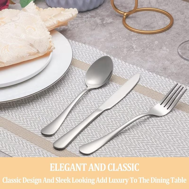 ilver cutlery set on a table with plates and a placemat.