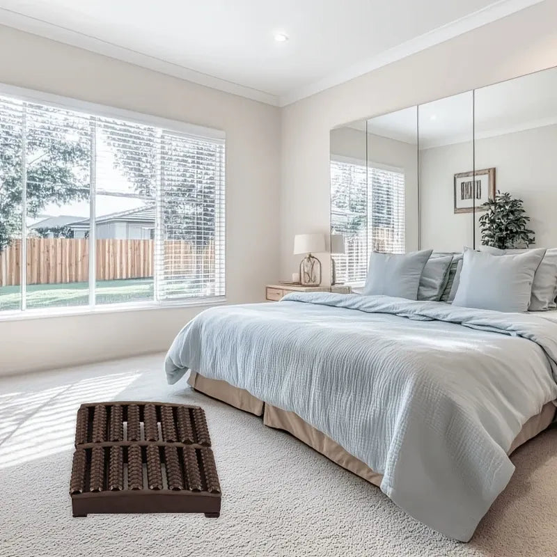 Modern bedroom with a large bed, mirror wall, and large window.