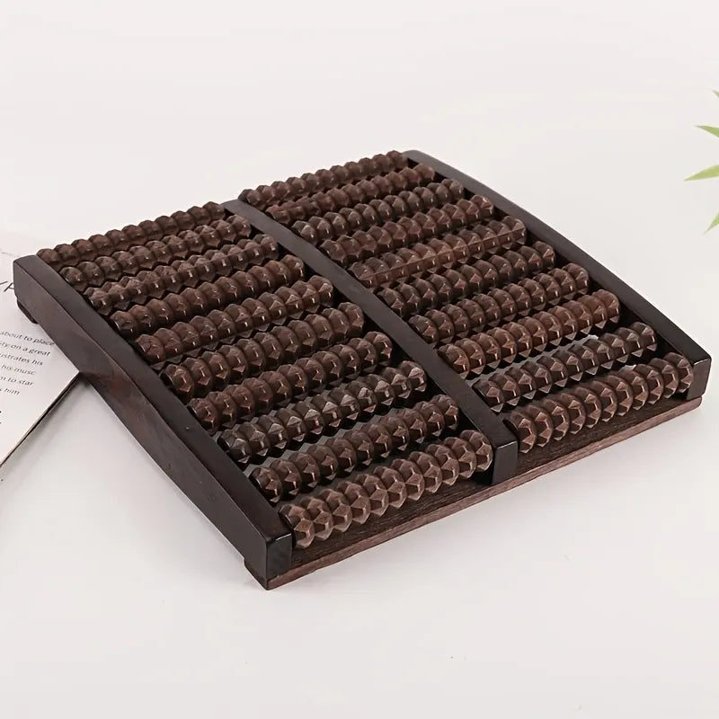 Wooden massage board with textured surface on a white background