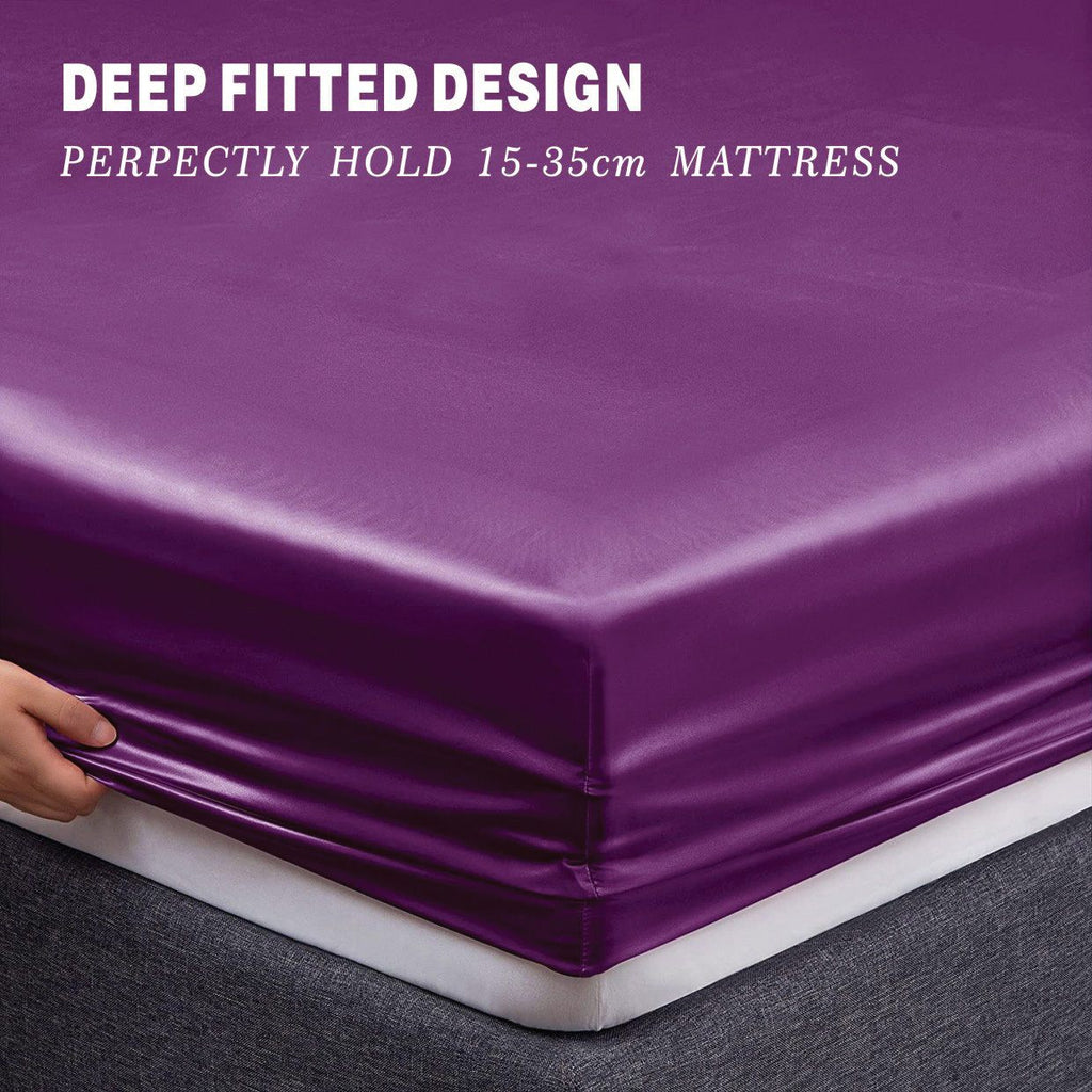 Purple mattress cover being fitted onto a mattress with text indicating its deep fitted design.