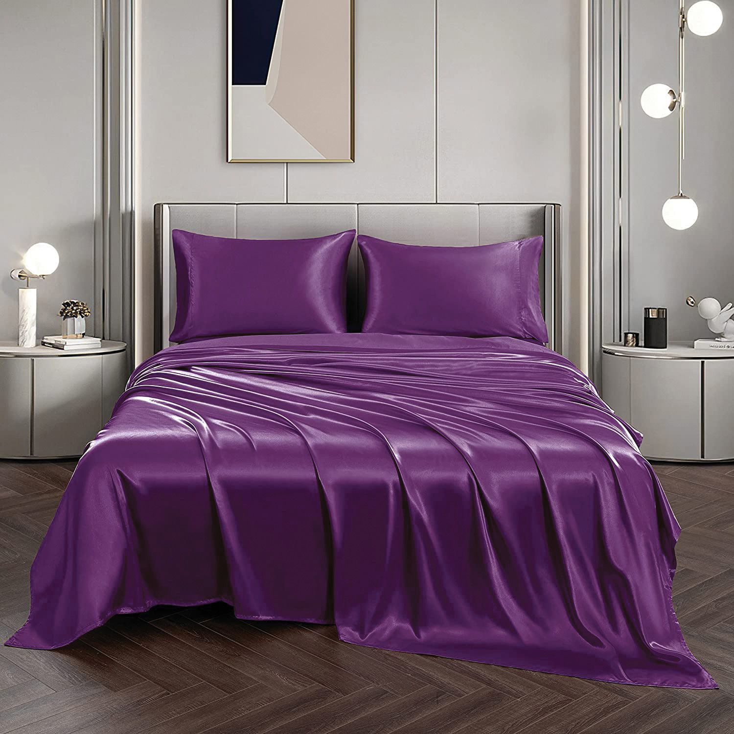Purple satin bedding set on a bed in a modern bedroom.