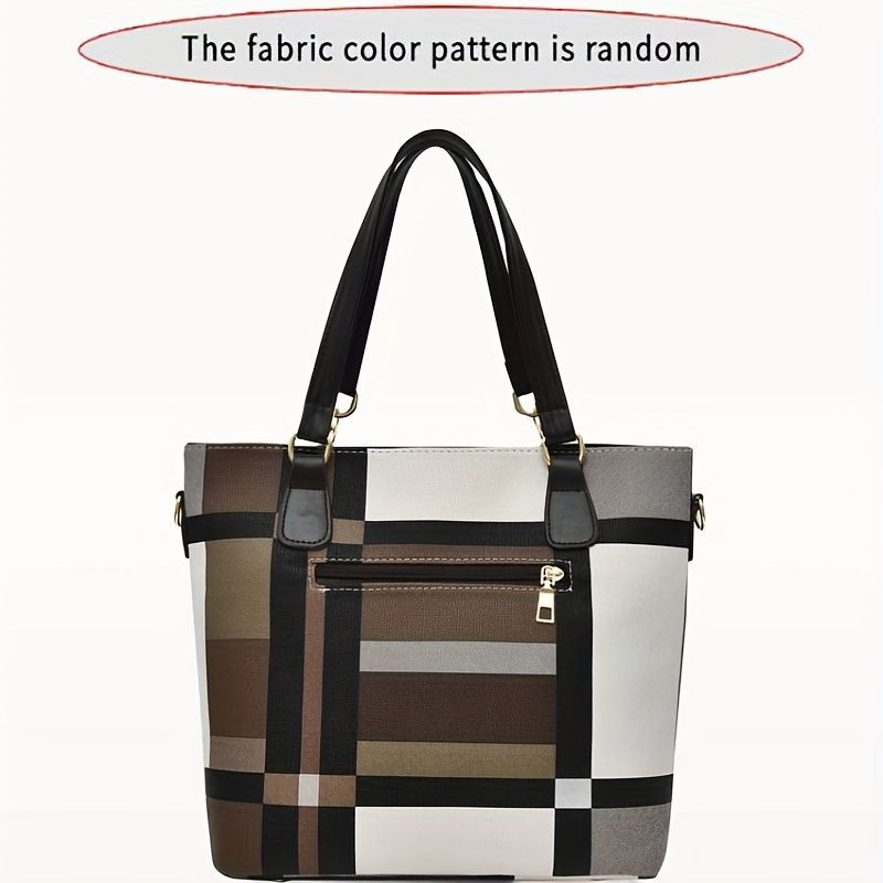 Plaid patterned handbag with black handles on a white background